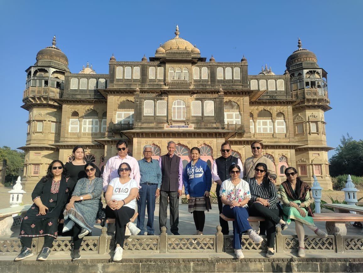 Tour group outside the majestic Vijay Vilas Palace heritage estate in Mandvi